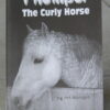 Close-up of a curly horse's head on a book cover.