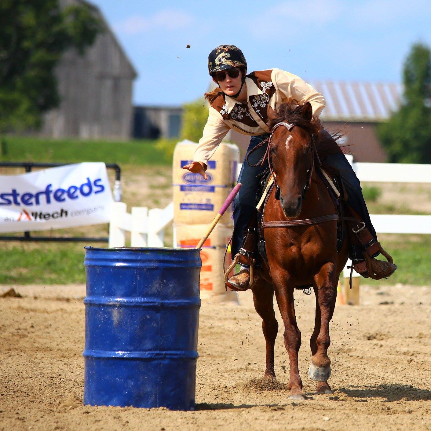 Rider throwing ball while on horse